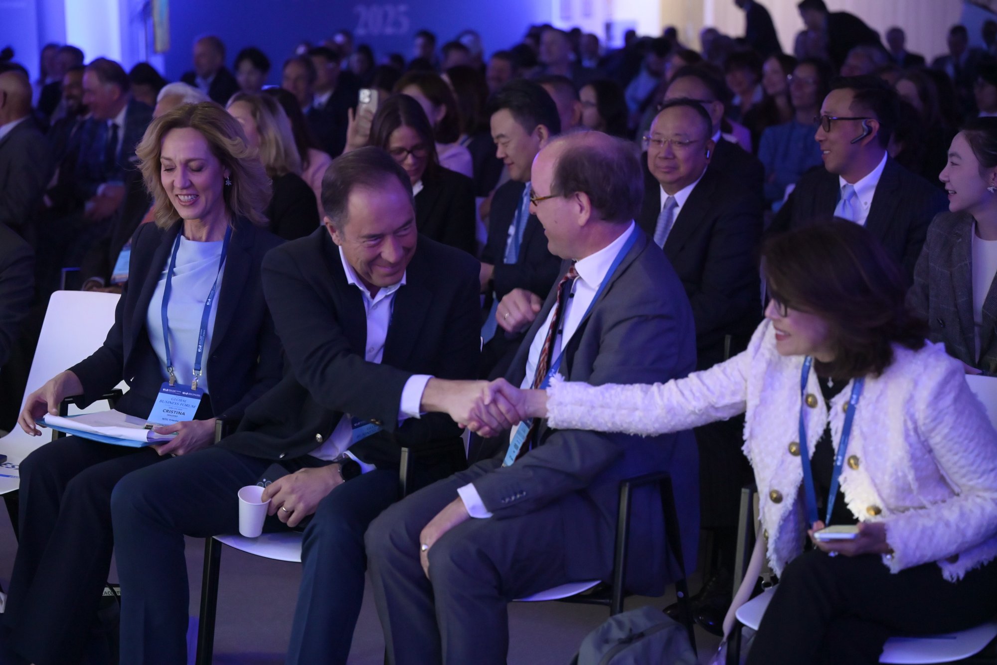 People smiling and shaking hands